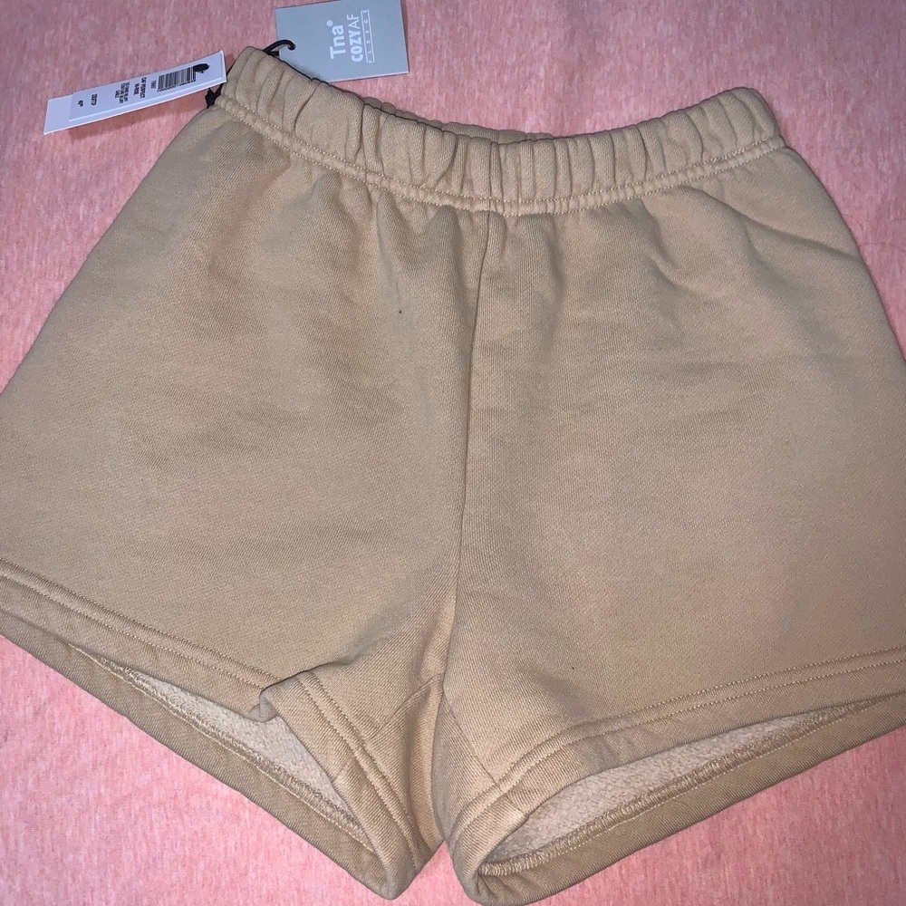 Cozy tan TNA sweatpant shorts from Aritzia!
